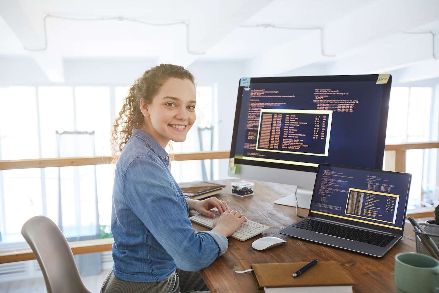 Portrait,Of,Female,It,Developer,Smiling,At,Camera,While,Typing