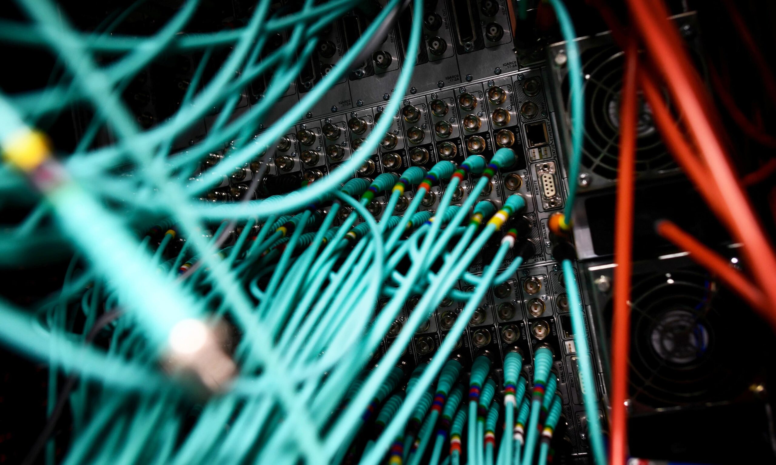 Cables and computers are seen inside a data centre at an office in the heart of the financial district in London